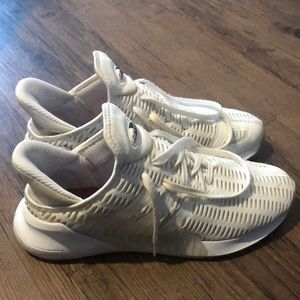 White Adidas athletic shoes